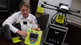 Betsy Sink demonstrates one of the automated external defibrillators that can be flown to the scene of a heart attack in Toano by Air 10, a James City County-owned drone devoted to medical emergencies.