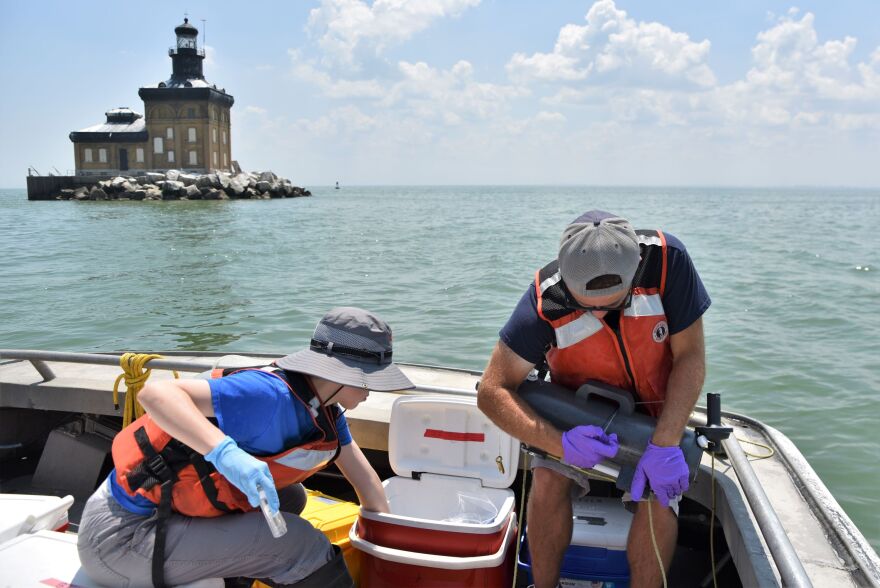 Researchers on a NOAA boat sampling water from Lake Erie in July.