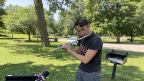 Brendan Dine performs on flute at Nelson Park in Mt. Pleasant on July 15, 2025. The Bay City Central High School senior earned a perfect score at Michigan’s State Solo & Ensemble Festival, ranking him as the state’s top high school flutist. He’ll attend Central Michigan University this fall on a full scholarship.