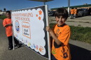 Endazhi Nitaawiging students Blaze and Damon hold a sign for the school's Orange Shirt Day walk on Sept. 30, 2026, in Red Lake.