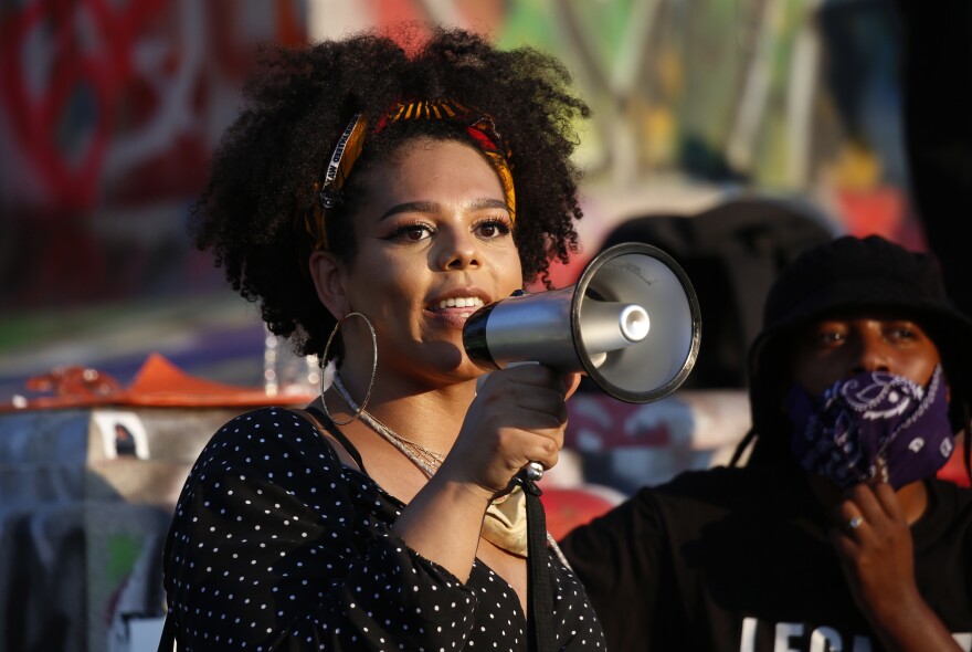 Aurora Higgs, an LGBTQ activist and Black trans woman, speaks during a demonstration at the Lee monument.