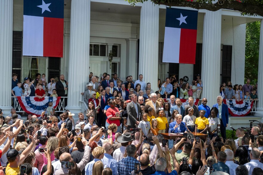 Gov. Greg Abbott signs SB2 authorizing educational savings accounts (ESAs) during a ceremony at the Governor's Mansion in Austin on May 3, 2025.