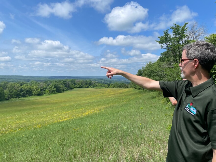 Andrew Hanson III looks out into hills the new addition to Devil's Lake State Park.