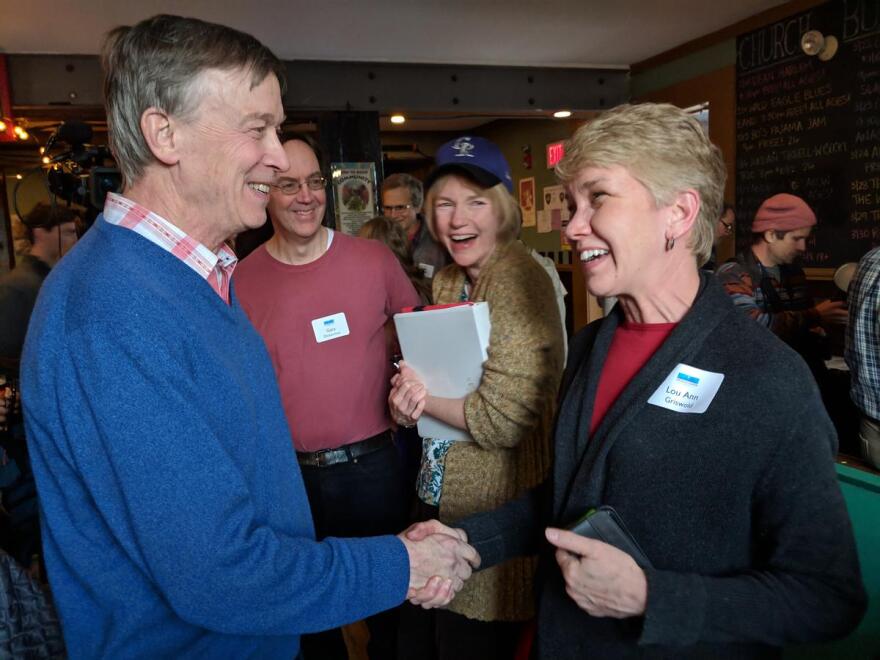 Former Colorado Gov. John Hickenlooper greets people at The Stone Church in Newmarket in March.