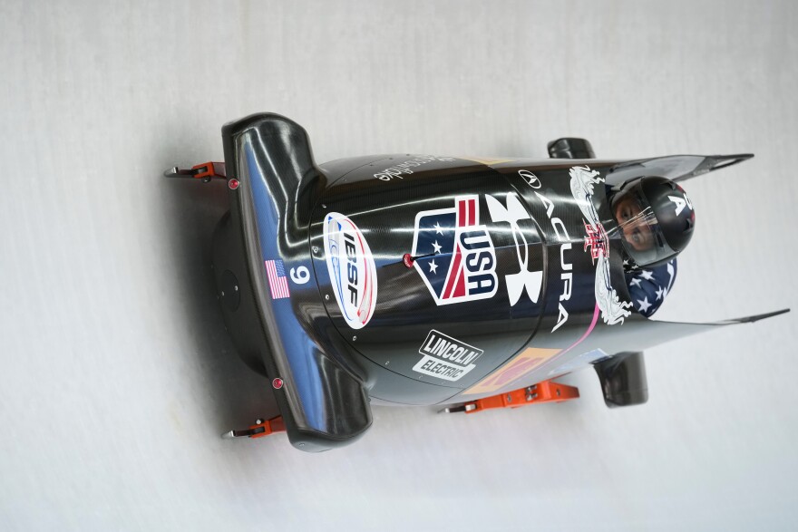 Kaysha Love and Azaria Hill, of the United States, race down the course during the 2-woman bobsleigh World Cup and Olympic test event in Cortina D'Ampezzo, Italy, Sunday, Nov. 23, 2025.