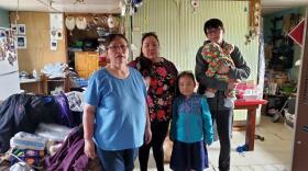 An Alaskan Native fmily inside a house