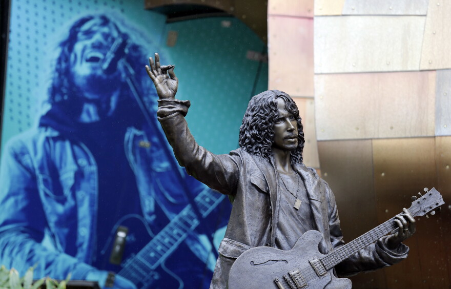 A life-size, bronze statue of late Soundgarden frontman Chris Cornell stands outside the Museum of Pop Culture a day after its unveiling, Monday, Oct. 8, 2018, in Seattle.