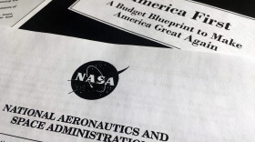 A portion of President Trump's first proposed budget, focusing on the NASA, and released by the Office of Management and Budget, is photographed in Washington, Wednesday, March 15, 2017. (Jon Elswick/AP)
