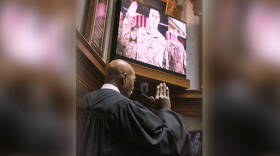 Indiana Supreme Court Justice Robert Rucker administers the oath of office to Sen. Jim Banks, R-Columbia City, who was video-conferencing in from Afghanistan.