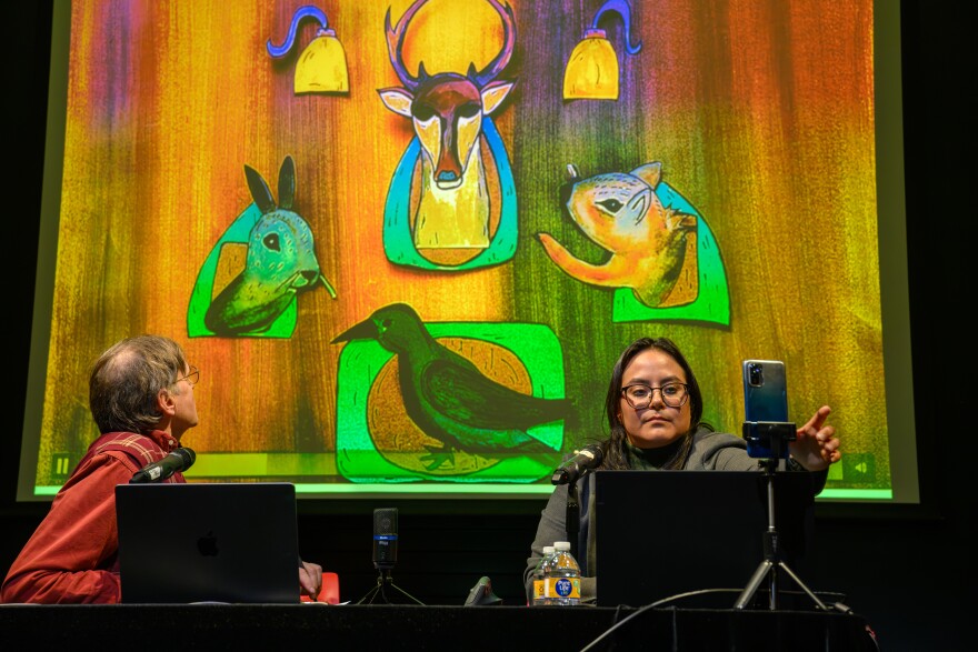 (L-R) John Bell, director of the Ballard Institute and Museum of Puppetry, watches a video of a puppet show produced by Ailin Ruiz, co-founder of Lormiga Títeres in Sonora, Mexico, during a forum on Mexican puppetry at UConn’s Ballard Institute and Museum of Puppetry.