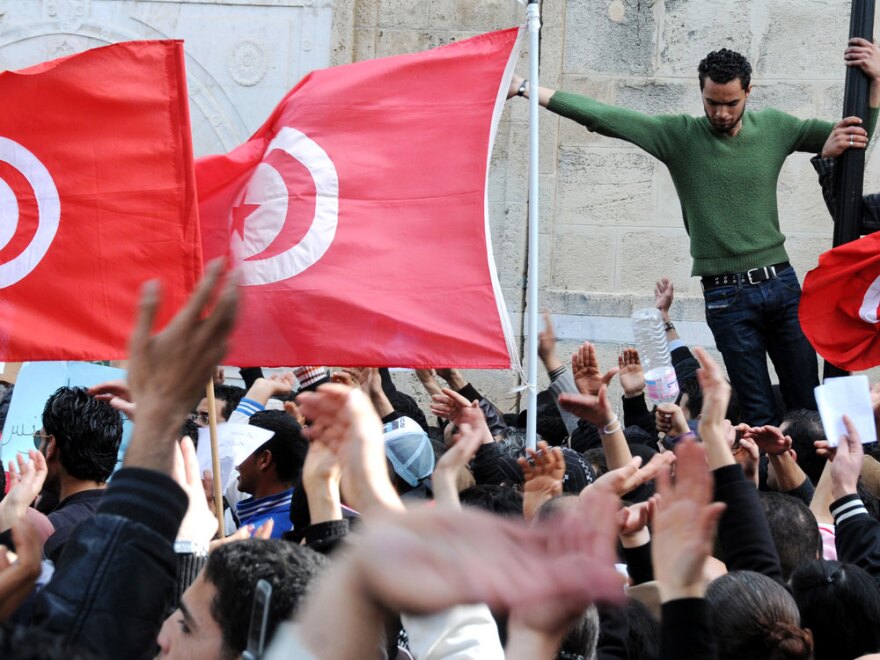 Thousands of people rally in Tunis on Feb. 20, demanding the government's resignation and a new constitution.