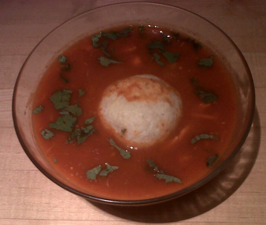 The<em> pozole</em> with matzo balls soup contains hints of chili, tomato and hominy.