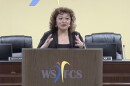 Walkertown Middle School Principal Monica Comer speaks at a podium