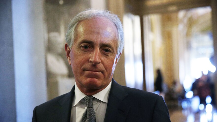 Sen. Bob Corker, R-Tenn., speaks to media at the Capitol on Dec. 1. Although Corker had voted against the Senate's original version of the tax bill, he says now he has changed his mind after "great thought and consideration."