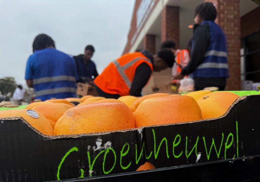Students at Voorhees University in Demark, South Carolina, work at Thursday afternoon's food drive. Beets and potatoes were some produce items available.