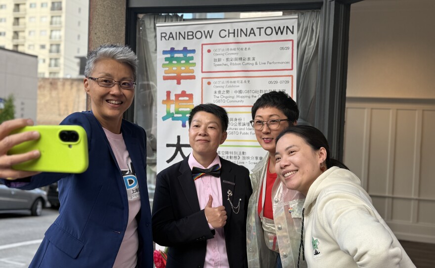 Friends take a selfie outside of the museum.
