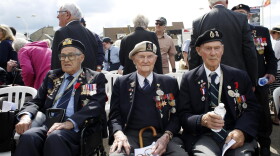British D-Day veteran Cyril Banks, center, sits with two fellow veterans during an event to mark the 75th anniversary of D-Day in Arromanches, Normandy, France, Thursday, June 6, 2019. (Thibault Camus/AP)