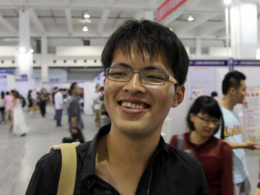Hou Feng, who graduated from Shanghai Maritime University, has been offered some entry-level jobs, but he's holding out for something more prestigious.
