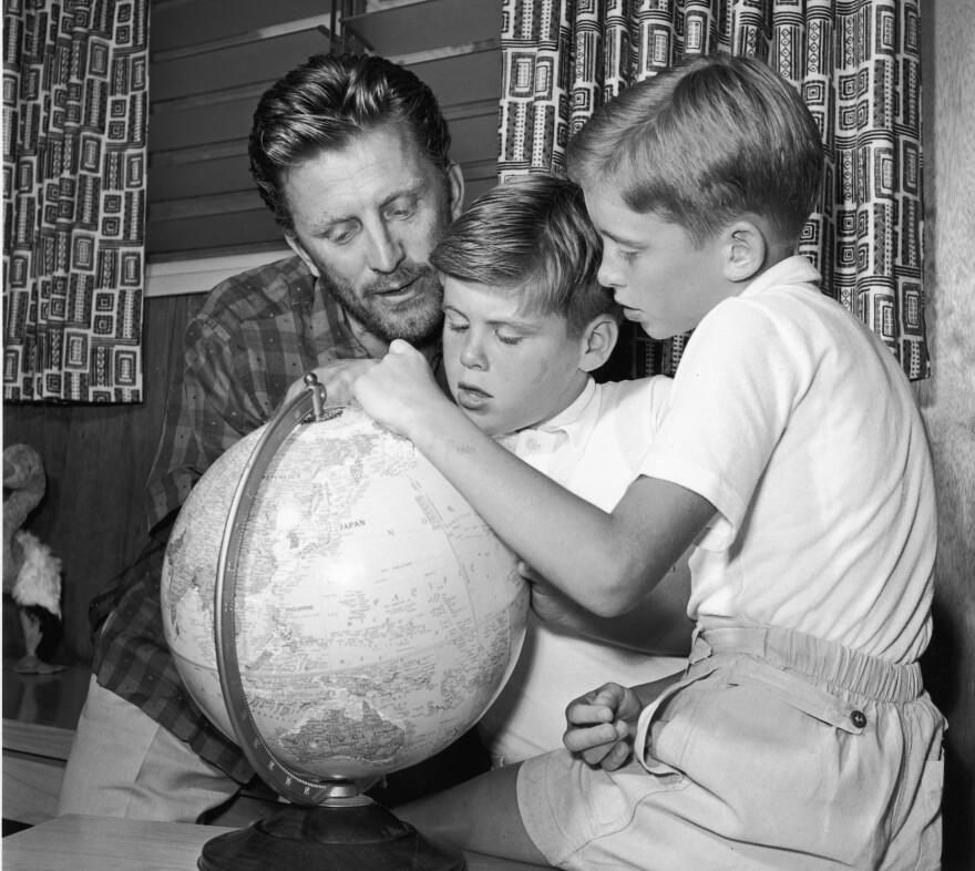 Douglas with his eldest sons, Joel (center) and Michael, circa 1956.