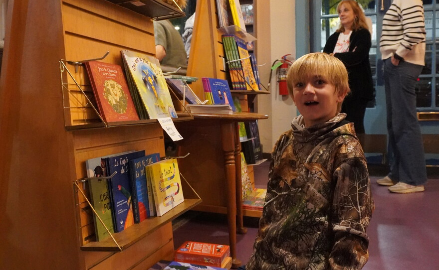 A little boy with a shocked face at the French Book Fest 