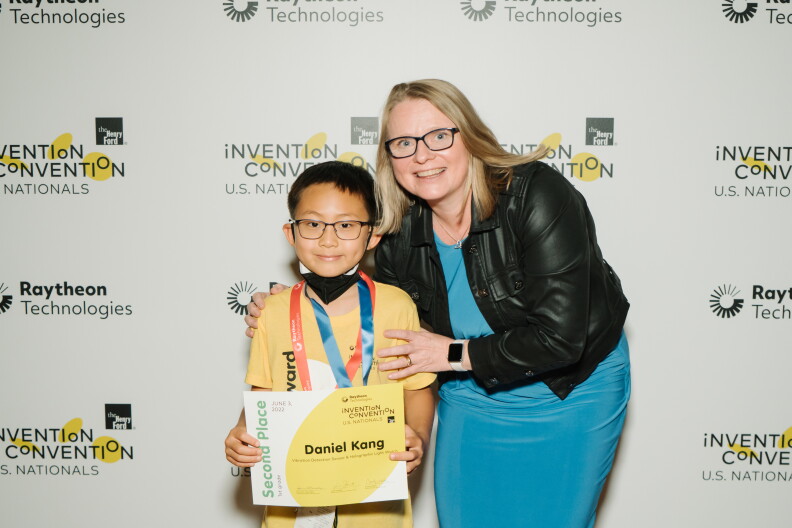 Daniel Kang receiving his award at the US Invention Convention Nationals.