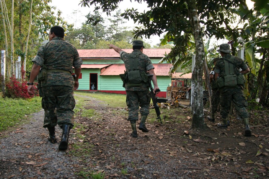 Guatemalan soldiers raid a ranch near Coban, Guatemala. The unit commander said the property belongs to a now convicted politically-connected drug trafficker. The ranch was deserted.