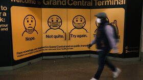 A display at Grand Central Terminal shows how to wear a face mask on October 21, 2020 in New York City. Recent data from John Hopkins University shows that the U.S. recorded 60,315 positive COVID-19 cases across the United States on Tuesday.  The U.S. has recorded at least 220,000 COVID-19 deaths, the highest death toll in the world. 