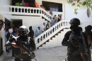 FILE - Colombians and Haitians who are accused of involvement in the 2021 assassination of Haitian President Jovenel Moise are escorted in handcuffs to their court hearing in Port-au-Prince, Haiti, May 26, 2025. (AP Photo/Odelyn Joseph, File)
