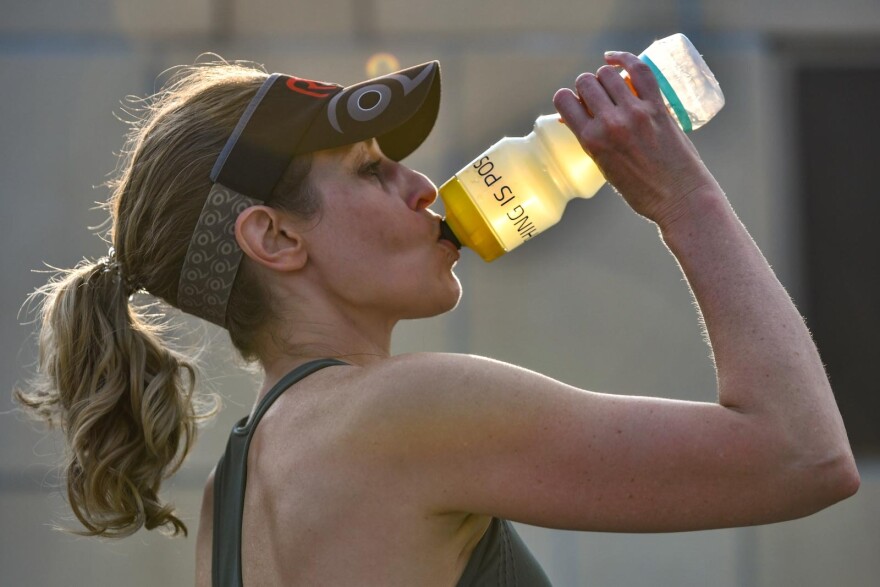 For members of the Reds, an all-female triathlon training group in Kansas City, stifling heat and humidity are just additional challenges to train for.