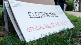 Protest material that resemble mail-in election ballots are seen as demonstrators gather on Kalorama Park to protest President Donald Trump donor and current U.S. Postmaster General  Louis Dejoy in Washington, DC.