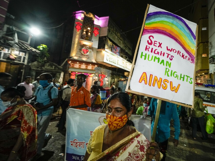 Sex workers and activists walk in a rally demanding right of work in government labor rules on the eve of May Day in Kolkata, India.