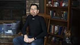 Cancer survivor Jim Nace poses in his Ballwin home. 