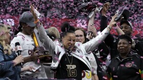 South Carolina head coach Dawn Staley celebrates after the Final Four college basketball championship game against Iowa in the women's NCAA Tournament, Sunday, April 7, 2024, in Cleveland. South Carolina won 87-75. (AP Photo/Morry Gash)