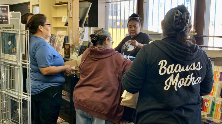 Reva Stewart manned the cash register at Drumbeat during its final sale on Saturday, Jan. 27. 