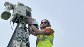 Quentin Newcomb with Security 101 installs a mobile Live Video Trailer surveillance unit on Friday, May 22, 2026, at Ontario Beach Park.