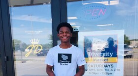 LaDamus stands in front of his family-owned JD Beauty Supply in Iowa City. Tasha Lard, the owner, is a co-chair on the South District Diversity Market Event Committee.