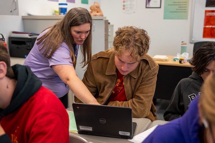 Sarah Gale helps student Richard Pilling on an assignment during a data science class at Lehi High School in Lehi, Utah on Nov. 24, 2025.