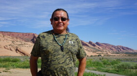 Raymond Peaches stands near where one proposed hydropower project might one day sit on the Navajo Nation. Critics of the project point to questionable tactics used by the developer and his allies as they advocate for the facility.