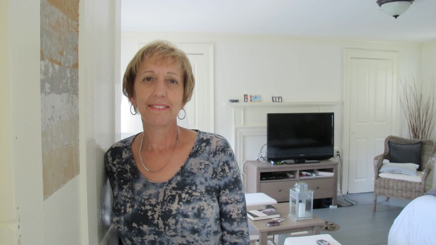 Eva Boice moved to Strawbery Banke from New York to be closer to her family. A retired social studies teacher, she appreciates the nuances of her new home, like the mismatched paint on her door panel. During renovations, contractors uncovered paint layers dating to the early 1800s.