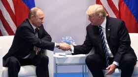 U.S. President Donald Trump and Russia's President Vladimir Putin shake hands during a meeting on the sidelines of the G-20 Summit in Hamburg, Germany, on July 7, 2017. (Saul Loeb/AFP/Getty Images)