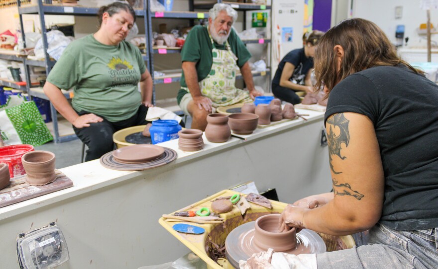 JaiDe Brown leads a cermanics demonstration during a recent class at City Arts in downtown Wichita. The six week course takes students through pottery basic throwing techniques to build pots, bowls, plates and other vessels.