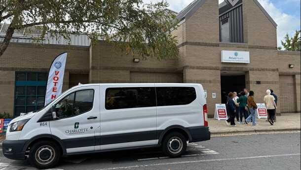 van in front of polling place