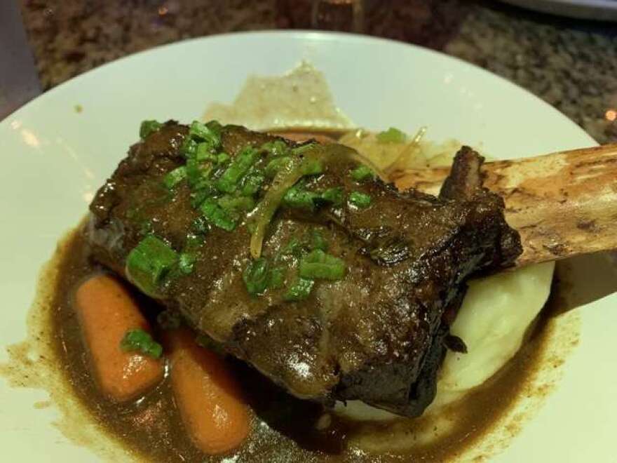 For my entree I selected that Short Rib Carbonnade, described as a “hearty Belgian dish” with a large braised rib with a gravy infused with beer, mustard and gingerbread.  Photo: Scott Joseph