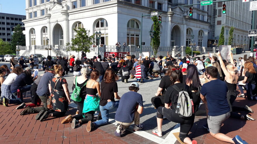 Protesters in Greensboro in June did the Black power salute to commemorate the murder of George Floyd.
