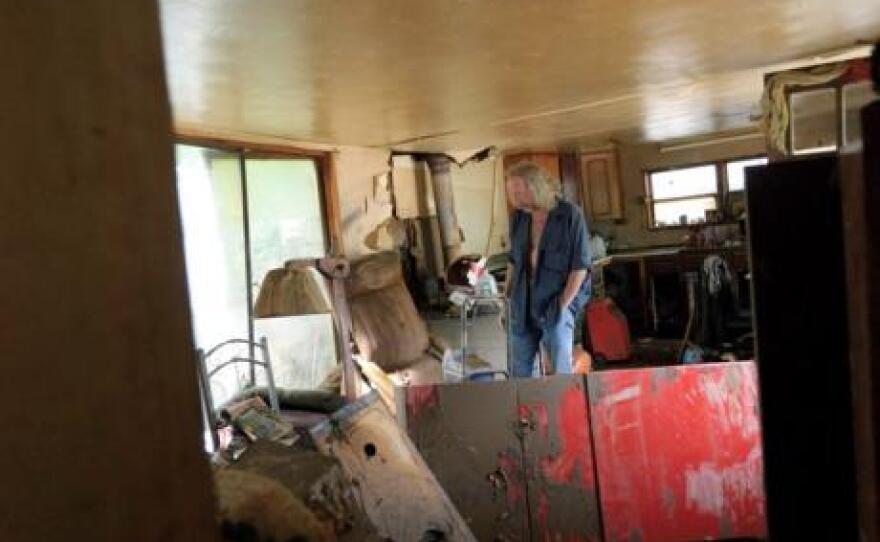 Conway Resident Dana Ferren inside his destroyed trailer