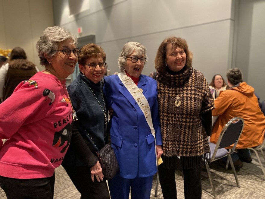 Sue Rosen, Rita Steinberg, Minnie Adkins, and Carol Butler are having a great time at Minnie's 90th birthday party.