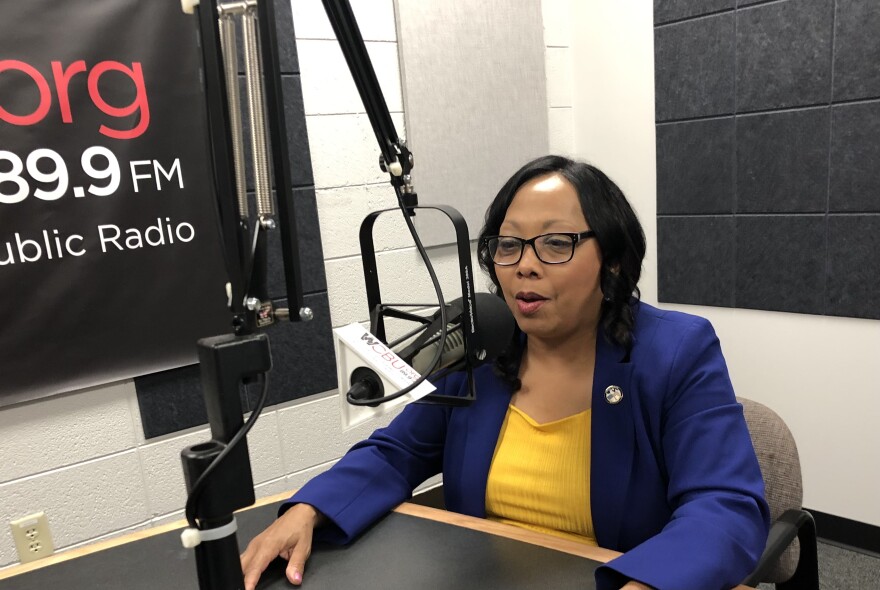 Peoria Mayor Rita Ali speaks into a microphone in the main studio at the WCBU Newsroom.