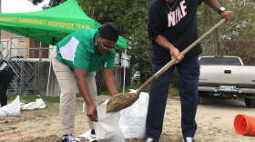 Lakeview residents fill sandbags at their local fire station to prepare for Hurricane Nate in 2017. 