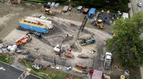 A drill bores geothermal wells for Eversource's networked geothermal pilot project in Framingham.
