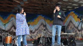 Casey Jack (right) leads a Yugtun beginner phrase session at Salmonfest on Saturday. He's joined by a friend on stage.